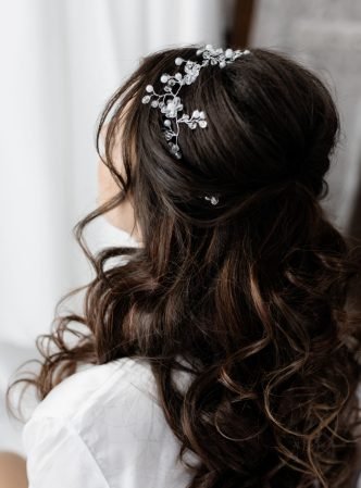 Bridal hairstyle close up, long curly brunette hair